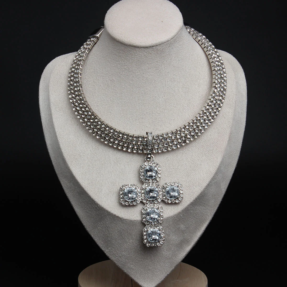 

Jesus' cross with diamond-studded crystal in hip-hop style. Wedding accessory. Gift for the wife.