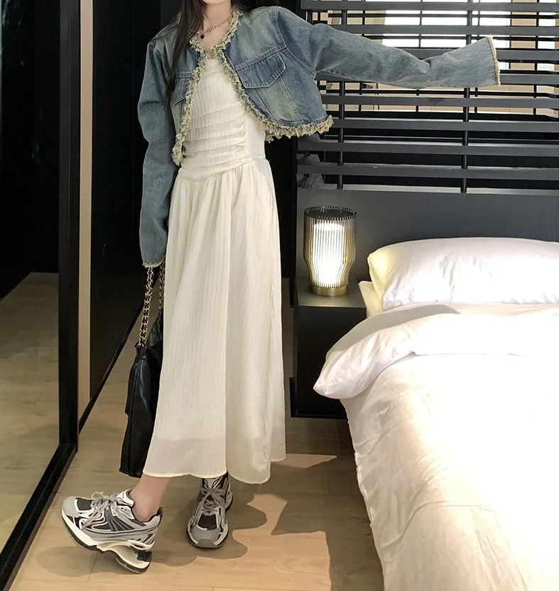 

White breast wrapped dress for women with a top top and bottom skirt, wearing a raw edge American denim jacket on the outside