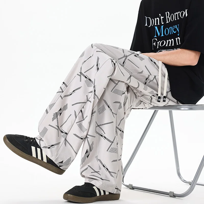 

2026 New Summer Thin Ice Silk Casual Pants Men's Design Sense Printed Scimitar Pants Loose Large Size Long Wide Leg Men's Pants