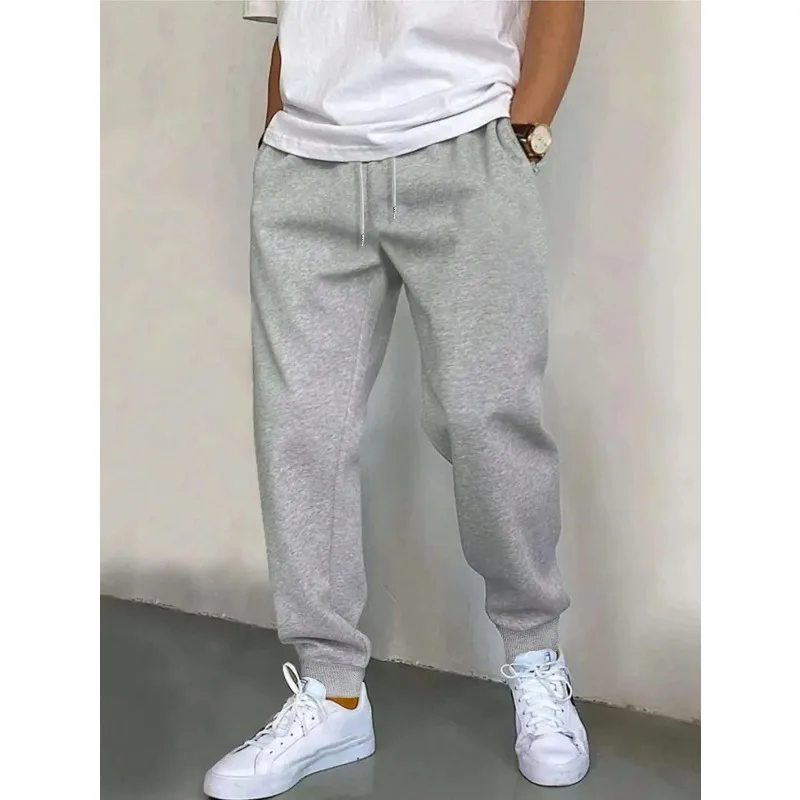 

Men's solid color slant pocket drawstring waist pants autumn and winter loose long sweatpants suitable for fitness and exercise