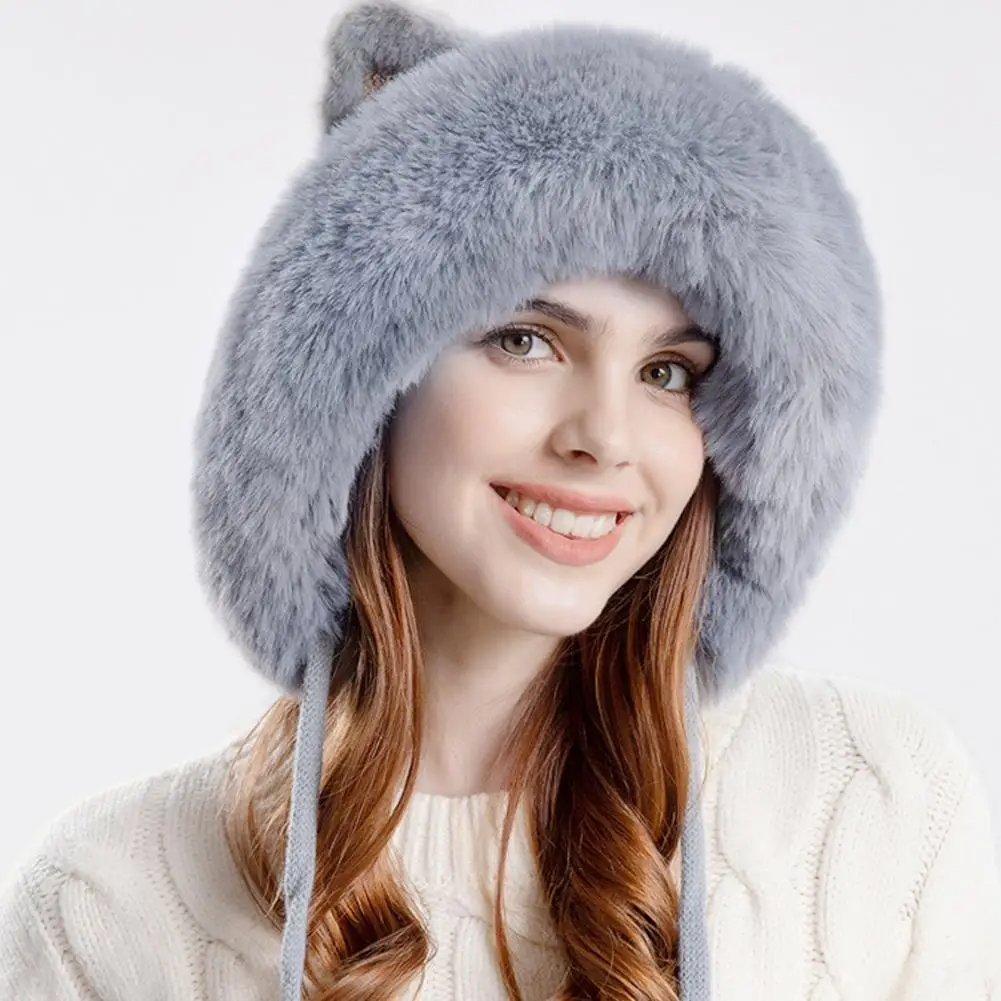 This hat is in the shape of a cat. It has fluffy ears and pompom, which is very cute.