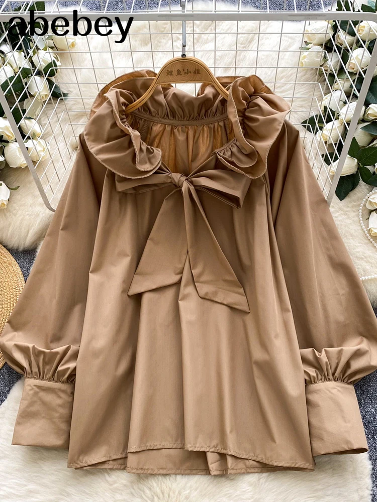 Elegancka bluzka z falbankami, stójką, długim rękawem i motywem motyli, w stylu vintage, luźna, francuska, idealna do biura, w stylu high street, na jesień 2026.