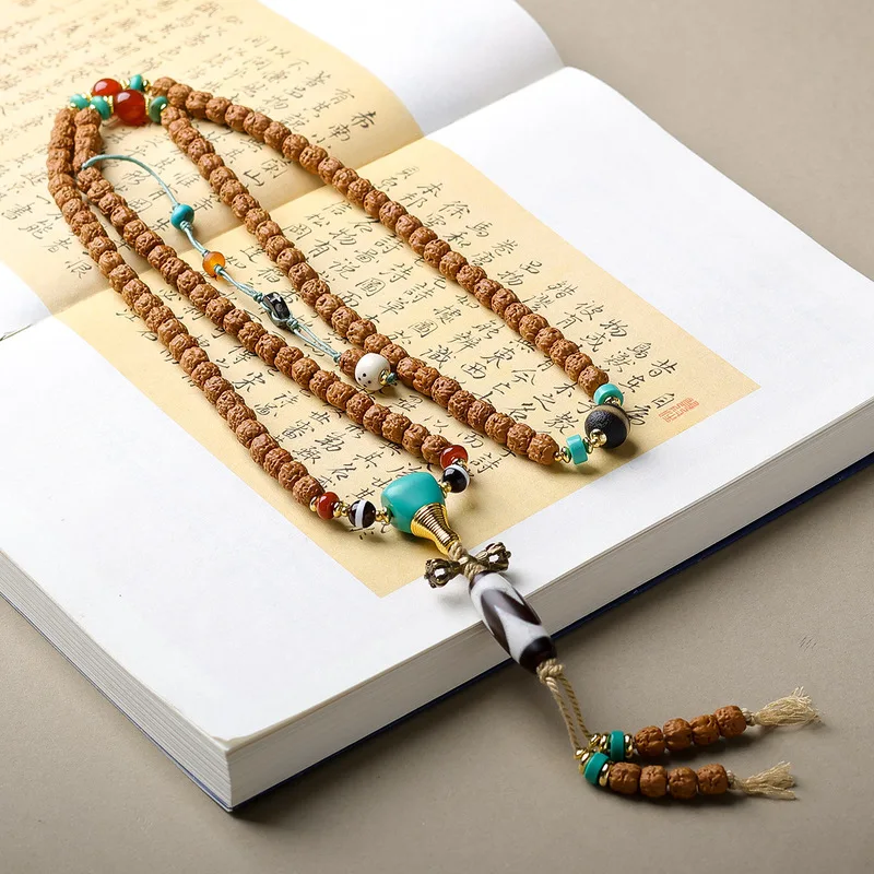 Original Buddhist hand-carved small Rudraksha seed bracelet with tiger tooth beads, turquoise, and three-way connectors in Chine