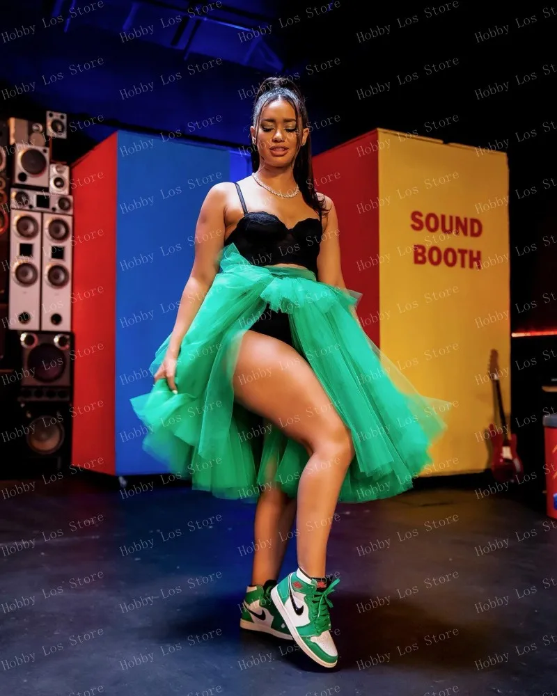 Green Tulle Skirt With Layers And Side Slit Worn By Woman Sitting On Stool In Backstage Area With Makeup Table Nearby Customize