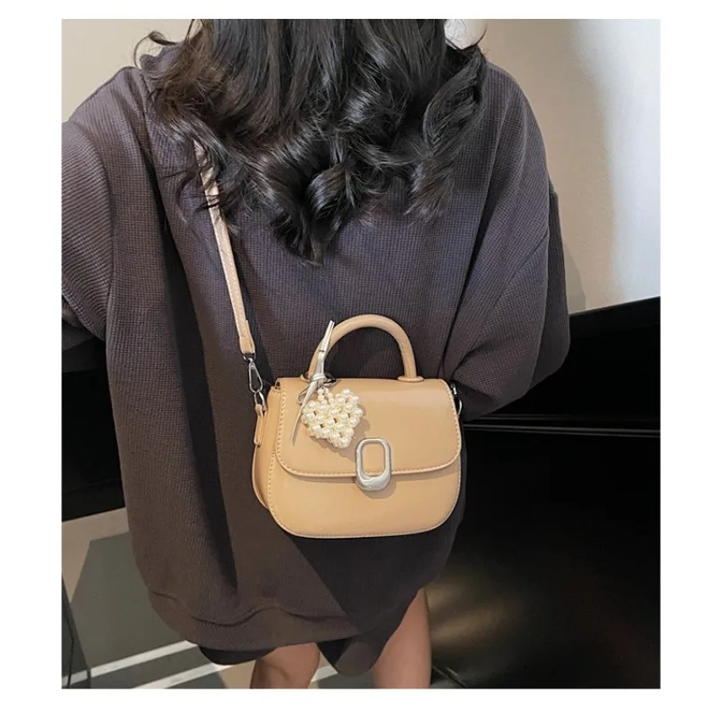 

Niche design sense of pearl small bag light luxury new hundreds of simple shoulder crossbody bag mini handbag with pendant