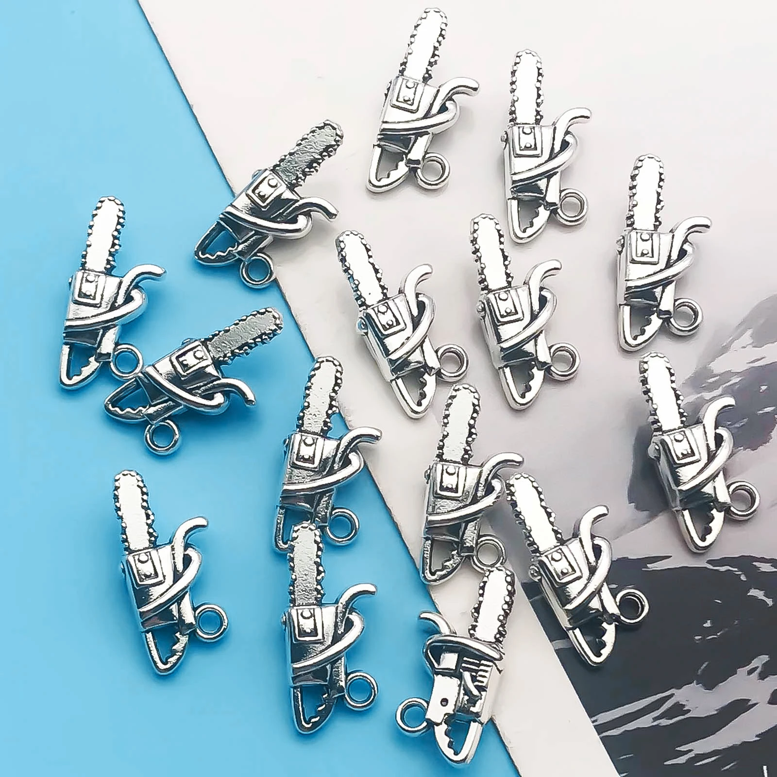 20Pcs Alloy Antique Silvery Chainsaw Pattern Charms Set