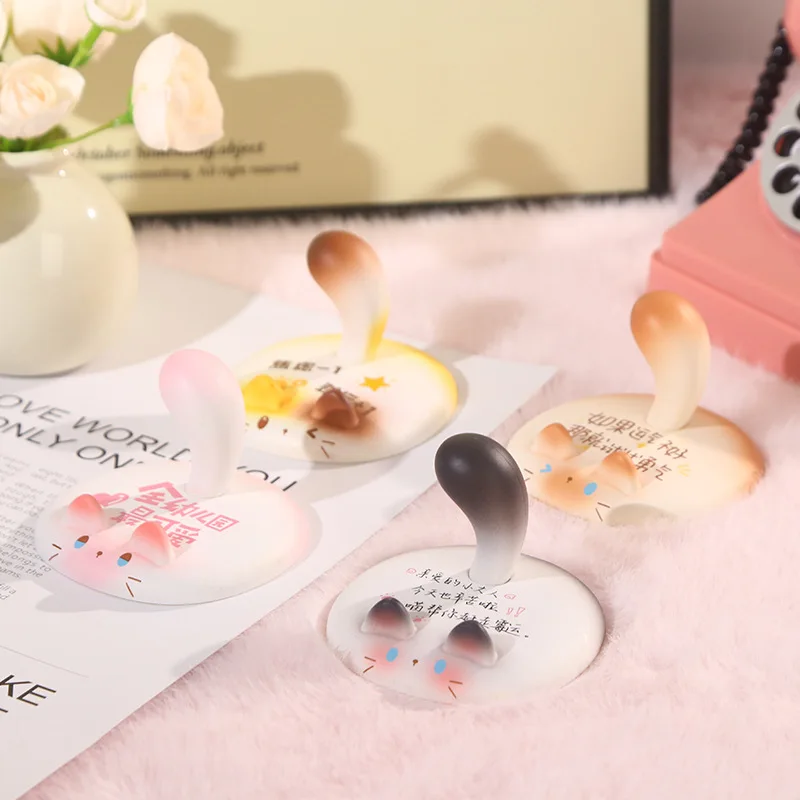 حامل هاتف Meow Meow بتصميم إبداعي رائع، أداة أساسية لحامل الهاتف المنزلي مع طلاء مطاطي لسطح المكتب