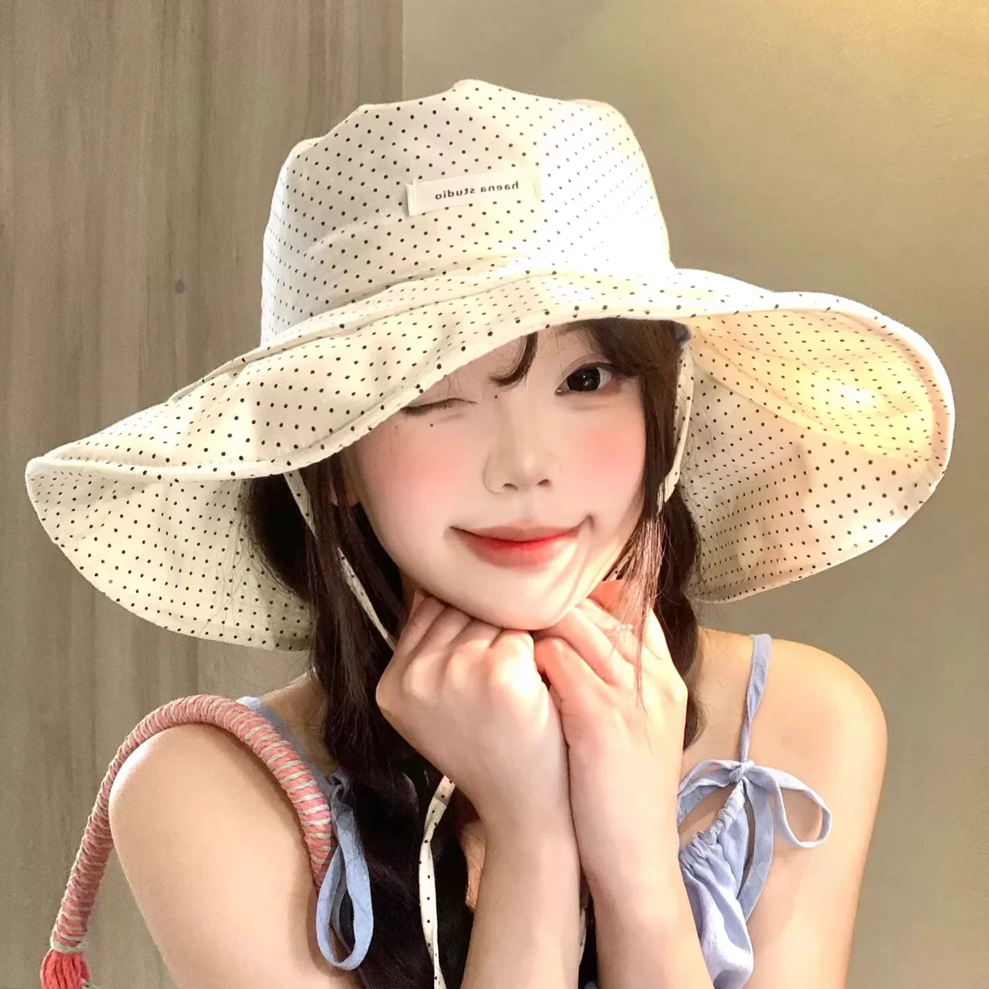 New polka dot strap bucket hat women's big brim sunscreen hat showing face small outdoor sun hat