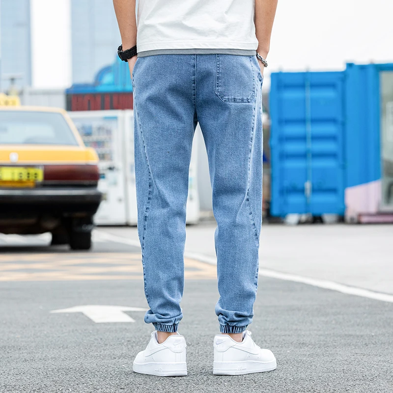 Nowe Duże Rozmiary 8XL Męskie Jeansy Jogger Streetwear Czarne Niebieskie Casualowe Spodnie Cargo Denimowe Elastyczne Bawełniane Spodnie Taper Jeansy Luźne Spodnie