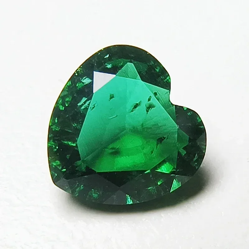 

Lab Grown Zambian Emeralds Heart Shape Hydrothermal Hand Cutting with Cracks Inclusions Inside Selectable AGL Certificate