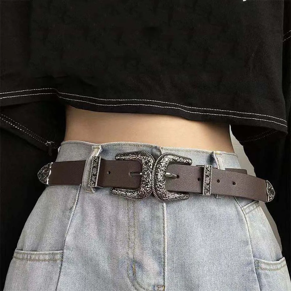 เข็มขัดคาดเอวแฟชั่นเท่ห์แบบหัวเข็มขัดคู่ สไตล์อเมริกัน หัวเข็มขัดแกะสลักปรับได้ เข็มขัดหนัง PU สีดำแบบวินเทจสำหรับผู้ชาย