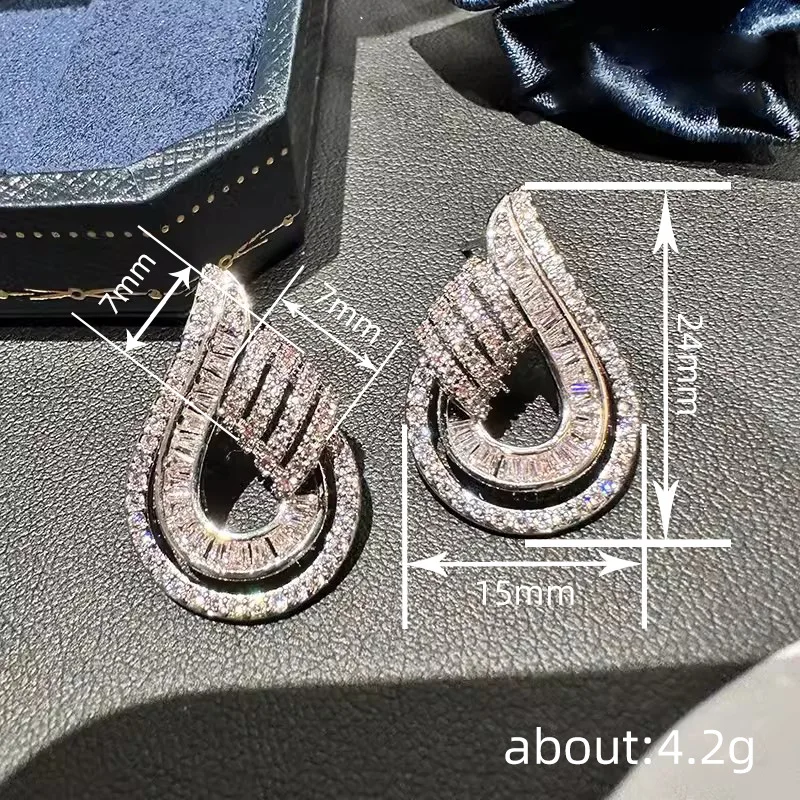 High end Shein style earrings for socialites, featuring female water droplet hollow design, with a light luxury urban trend