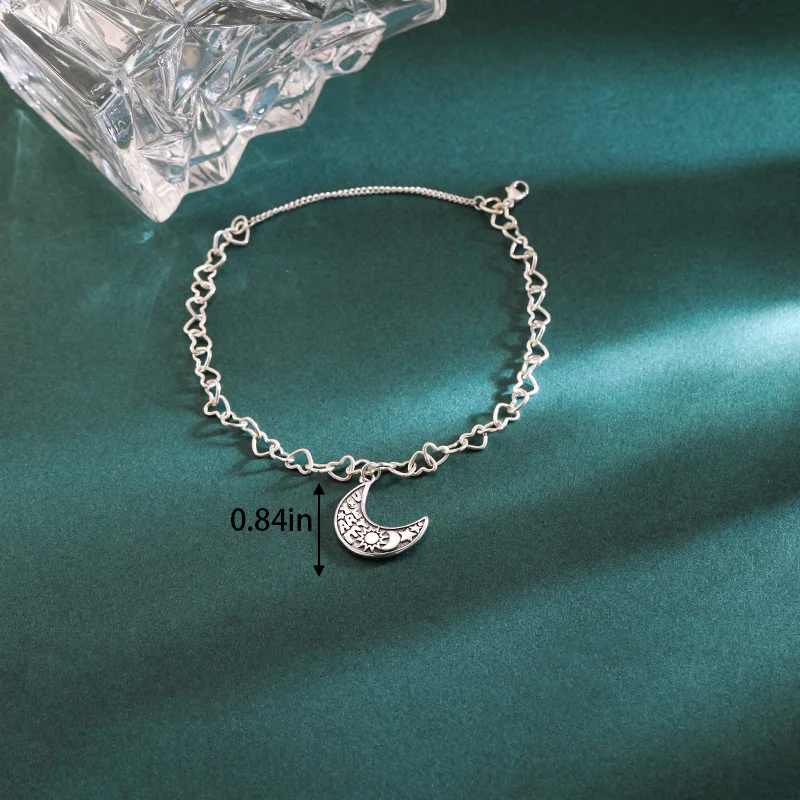 

S925 sterling silver James Avery Light Connected Hearts charm bracelet paired with a moon pendant