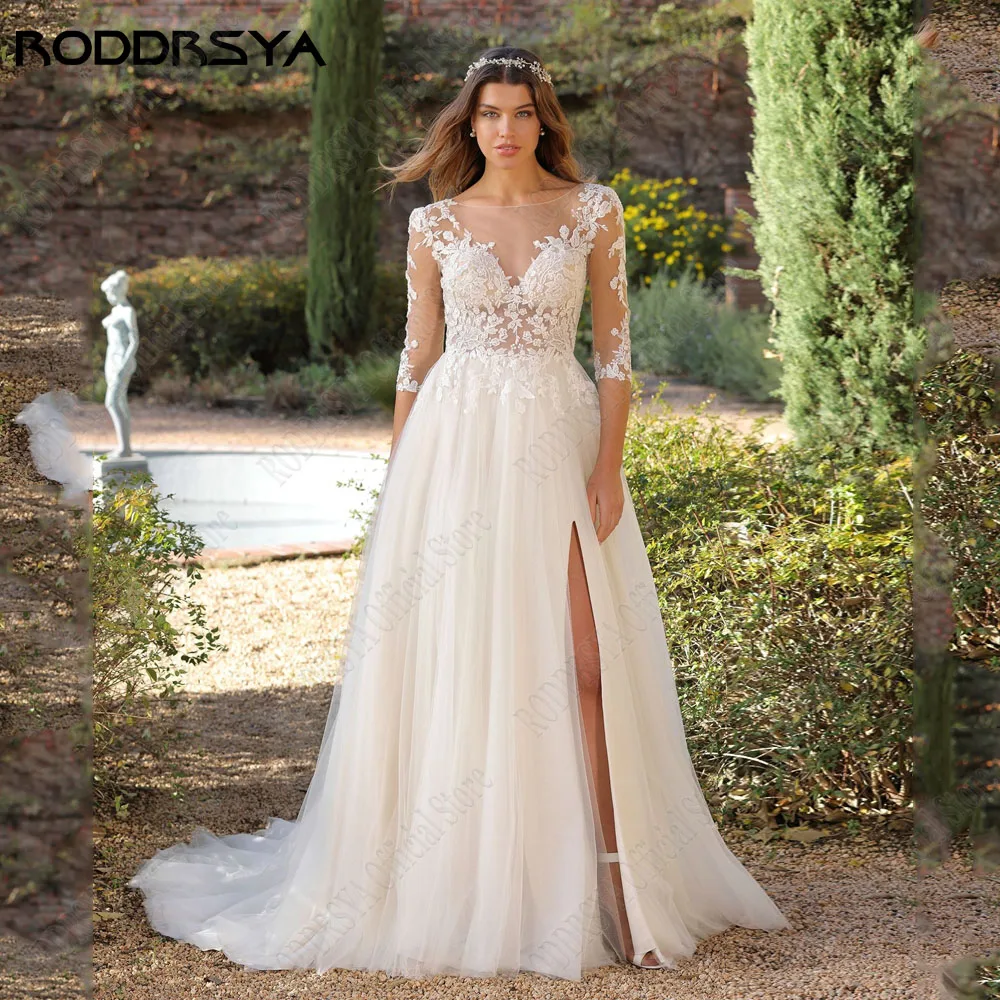 RODDRSYA 3/4 Mouwen Scoop Bruidsjurk Side Split A-Lijn Tule Illusie Knop Terug Applique Boho BruidsjurkenRODDRSYA 3/4 Mouwen Scoop Trouwjurk Kant A-lijn Tulle Illusie Knop Terug Applique Boho Bride Gowns robe de mariée