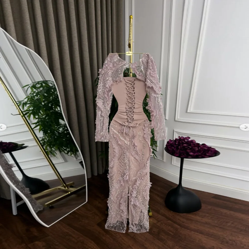 Classic pink long-sleeved evening gown with a sweetheart neckline; mermaid-style prom dress featuring exquisite appliqué