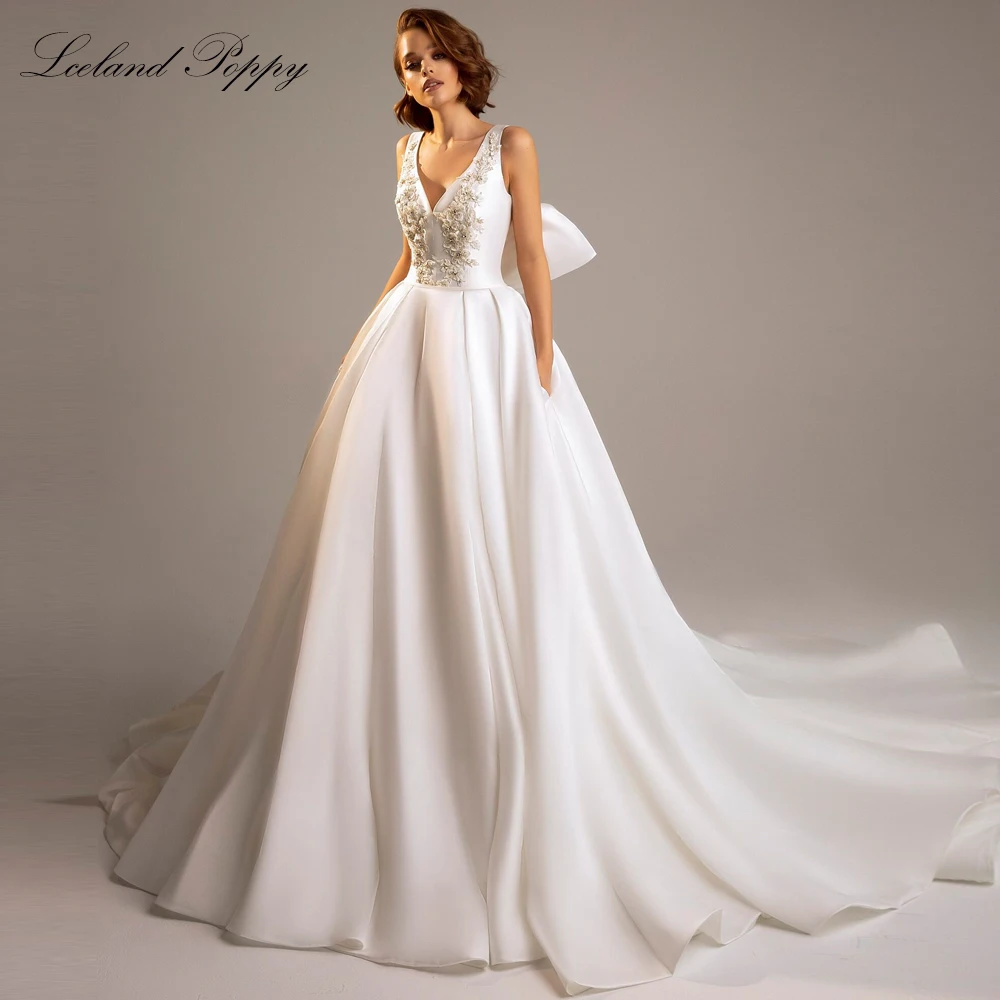 

Lceland Poppy Customized A Line V Neck Satin Wedding Dresses Sleeveless Beaded Backless Bridal Gowns with Pockets