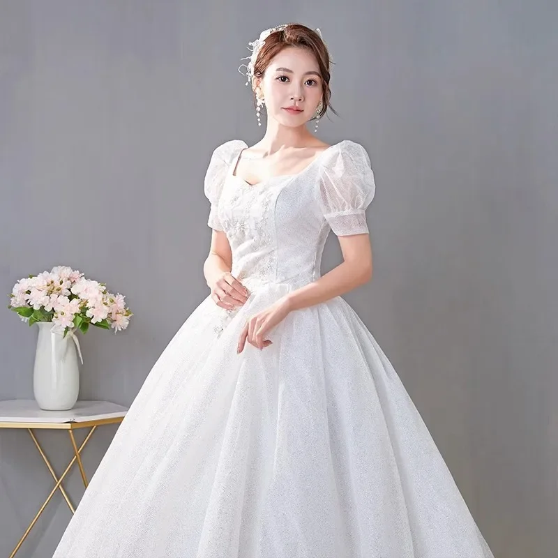 Vestidos de novia de tul ostentoso blanco, cuello cuadrado, mangas cortas, Princesa, longitud hasta el suelo, talla grande, vestido de baile de novia Simple, XN056