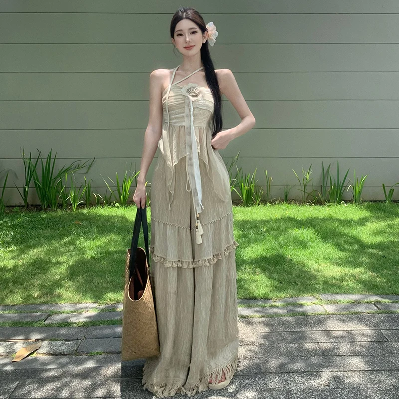 Completo estivo da donna in cotone e lino con top a fascia, pantaloni a gamba larga con nappe e gonna a vita alta in poliestere...