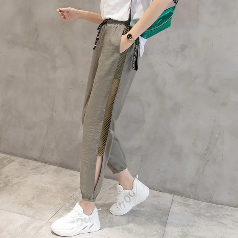 2023 Summer New Thin Mesh Hollow Out Harem Pants Women Loose Solid Color Drawstring Pockets Leisure Time Cropped Sports Trousers