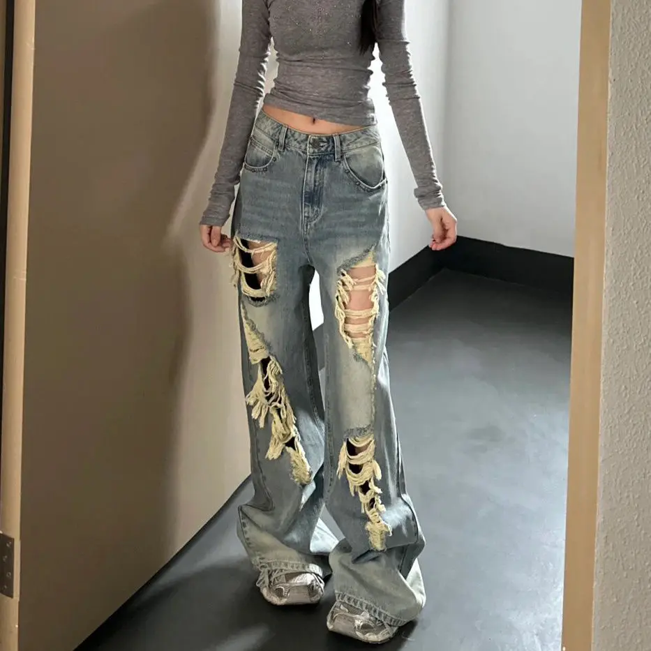 

American street loose jeans women's autumn and winter new niche hole design sense straight slim fashion old mop pants.