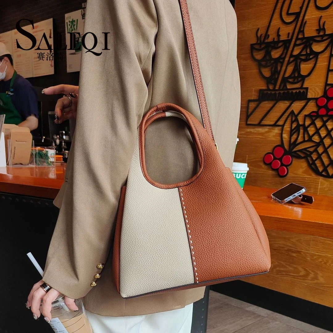 Genuine leather New vegetable basket handbag  simple and versatile  The Korean version of the contrasting color commuting bag