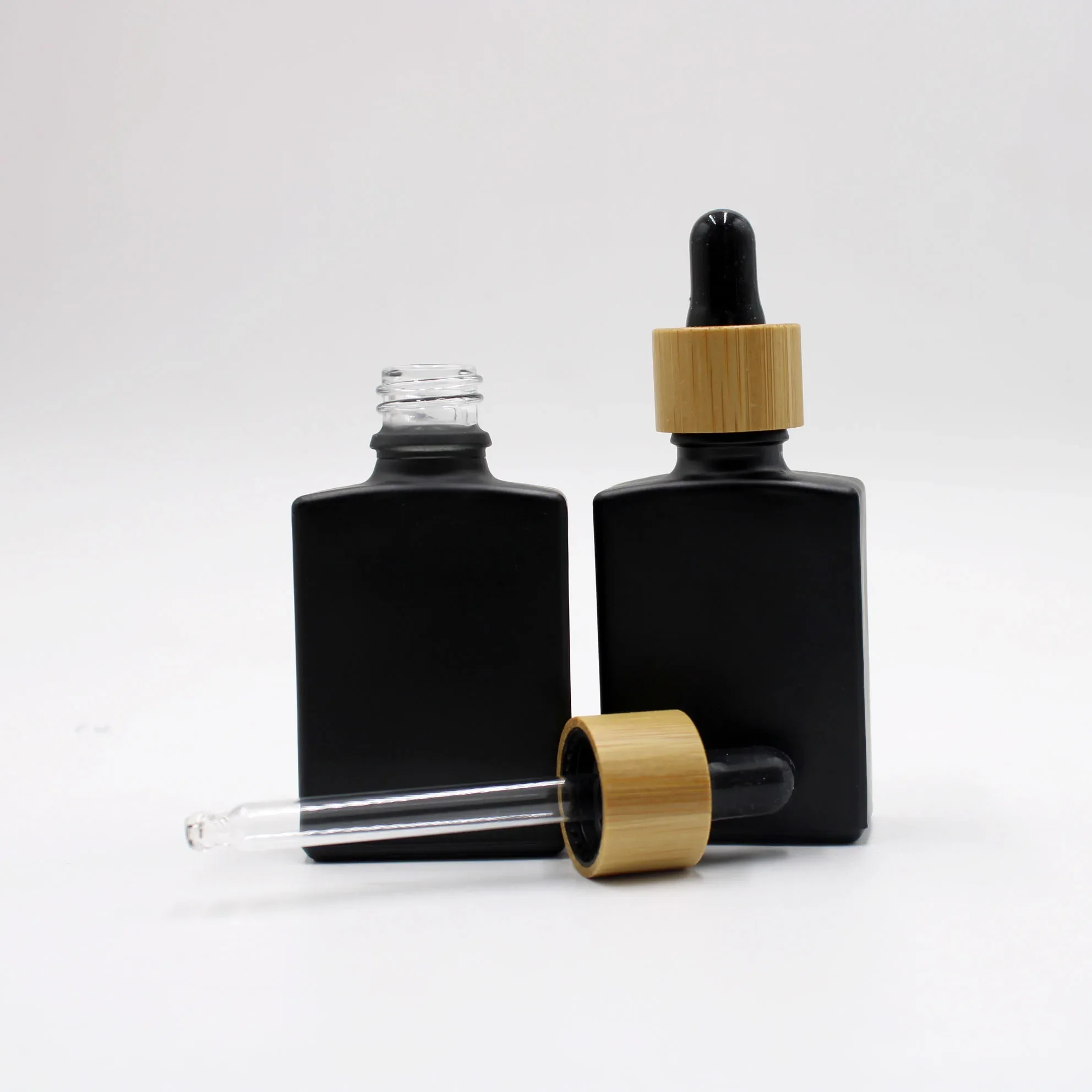 

Square Shape Bottle Dropper Bottle Glass Jar with Lid Jar Engraving Logo on Cosmetic Oil Glass Dropper Bottle with Bamboo Cap