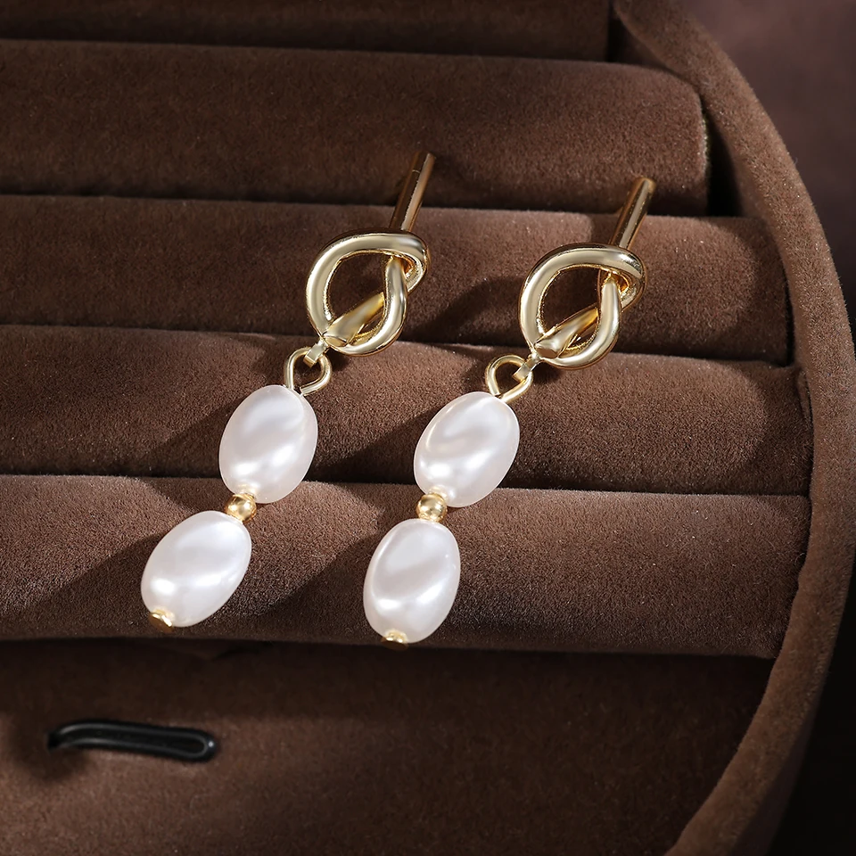 ZAKOL Goldene geknotete Metall-Imitat-Perlen-Anhänger-Ohrringe für Damen, eleganter Party-Schmuck, Urlaubsgeschenk