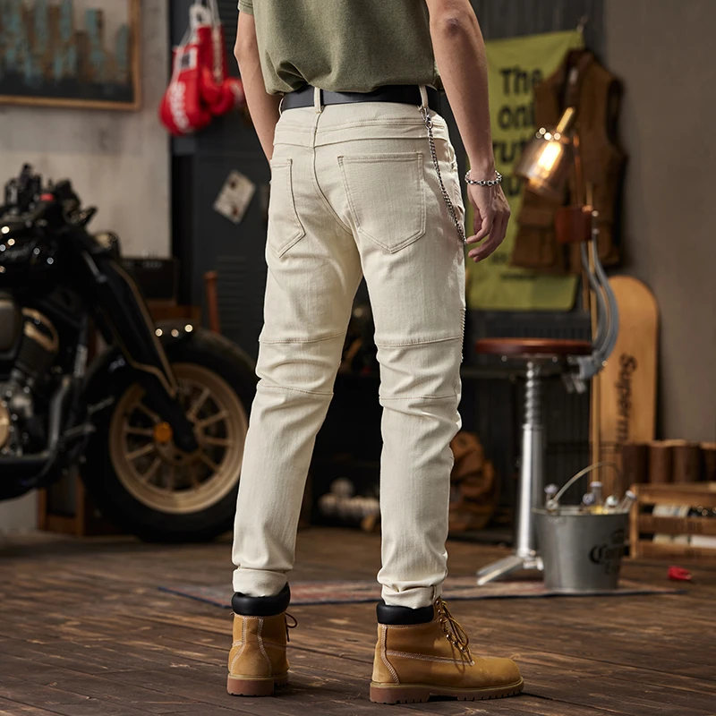 Pantalones vaqueros de motocicleta plisados para hombre, diseño de costura Beige, moda de calle alta, ajustados, atados al tobillo, marca de moda, Trous de motocicleta