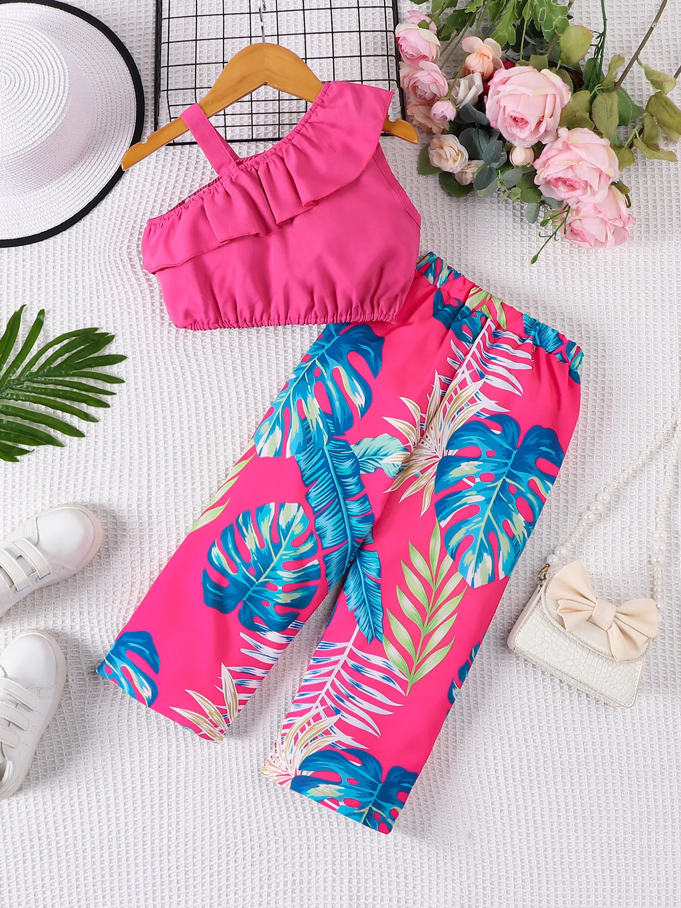 Two piece summer girl fashion vacation style suspender sloping shoulder top and floral full print pants set