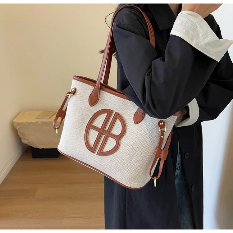 

New Large Canvas Tote Bag - Spacious Work Bag with Adjustable Strap, Eco-Friendly & Lightweight, Perfect for Commute & Travel