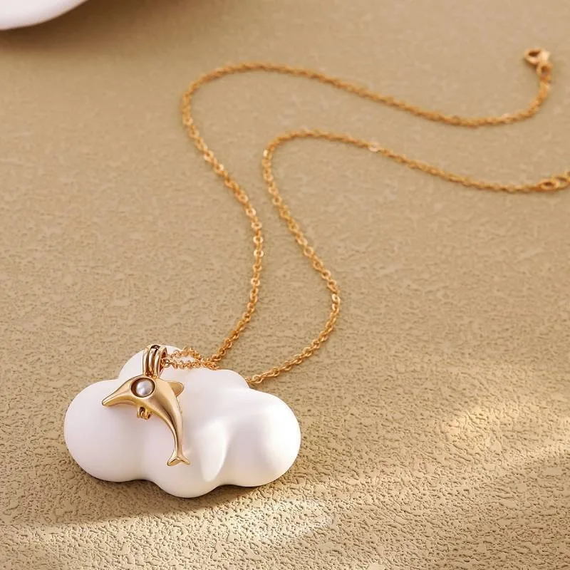

Popular European and American dolphin pearl necklace with open hollow-out pendant and clavicle chain