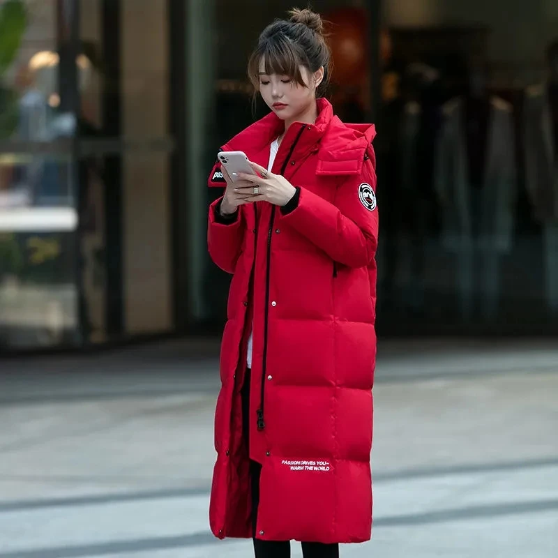 Manteau à capuche en duvet d'édredon blanc pour femme, tempérament féminin, long, version coréenne, mode hivernale, chaud, optique, marée, nouveau