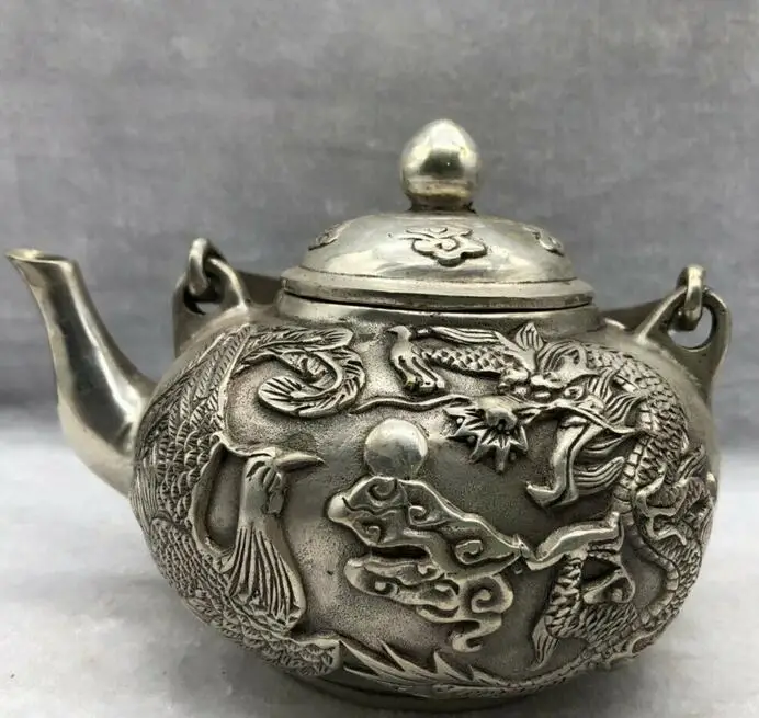 

Chinese Old Tibetan Silver Hand Carved Dragon & Phoenix Teapot w Qianlong Mark