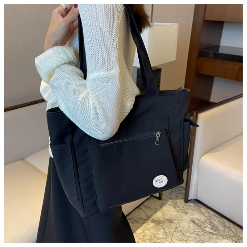 المرأة حقيبة كتف الموضة فئة سعة كبيرة طالب حمل حقيبة 2025 جديد قماش ركاب حمل حقيبة حقيبة نسائية