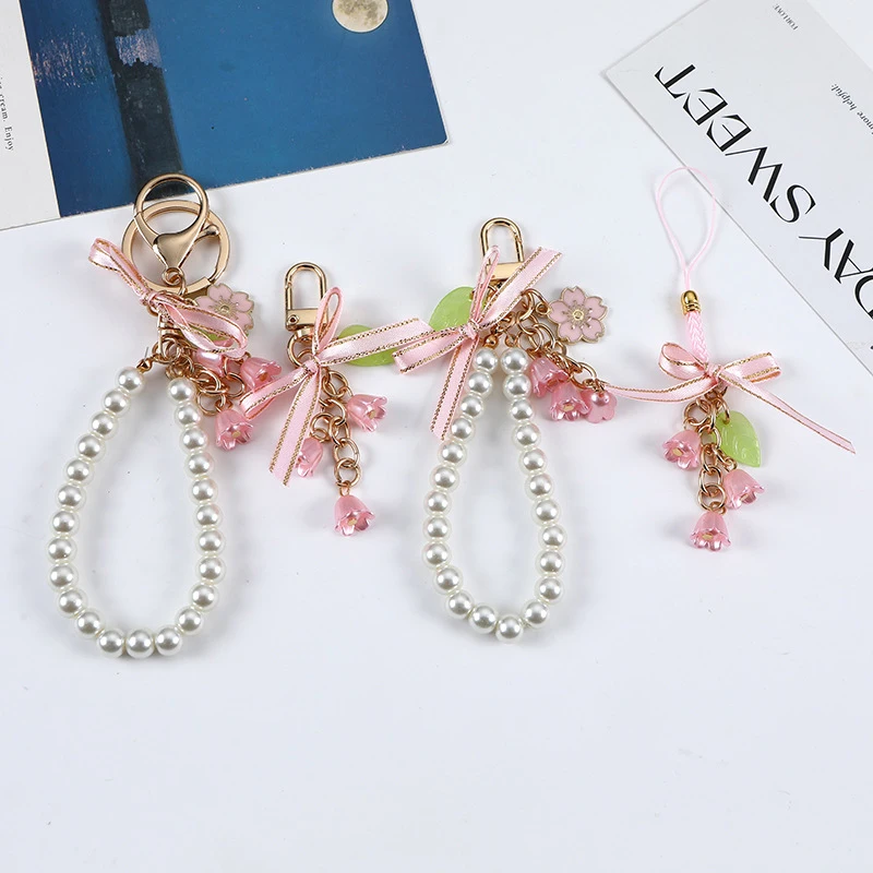 Sweet Pink Butterfly Knot Lily Flower Pearl Blossoms Key Chain Phone Pendant Car Key Ring Headphone Case Charms Bag Accessories