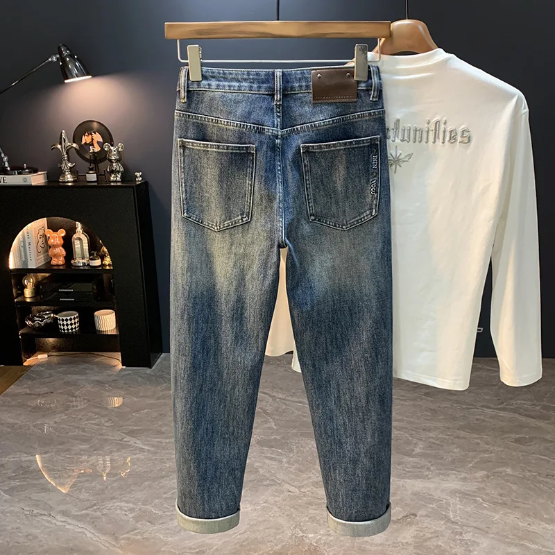 جينز جديد لخريف 2025 عالي الجودة فضفاض ومستقيم الساق للرجال موضة شارع العليا متعدد الاستخدامات النسخة الكورية سراويل تقليدية