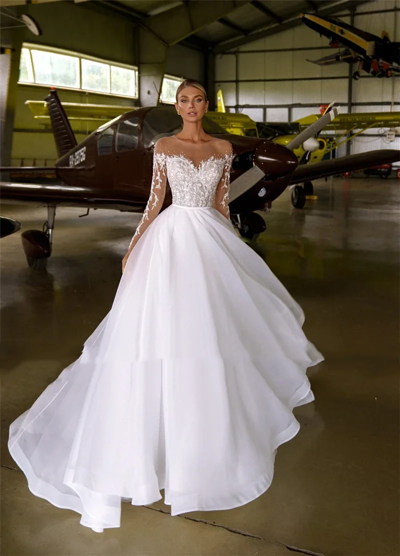 

Flavinke Customized Sheer Neck Heavy Crystals Long Sleeves White Wedding Dresses 2025 Organza Tulle A-line Bling Bridal Dresses