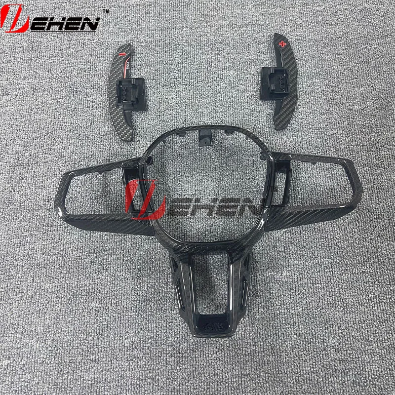 

Накладка на руль из карбона для новых BMW 5 серии G60 G70 M5 G90 i5 M60 i7 X2 M35i G48 G18 X5 X6 2025-2026 с подрулевыми переключателями