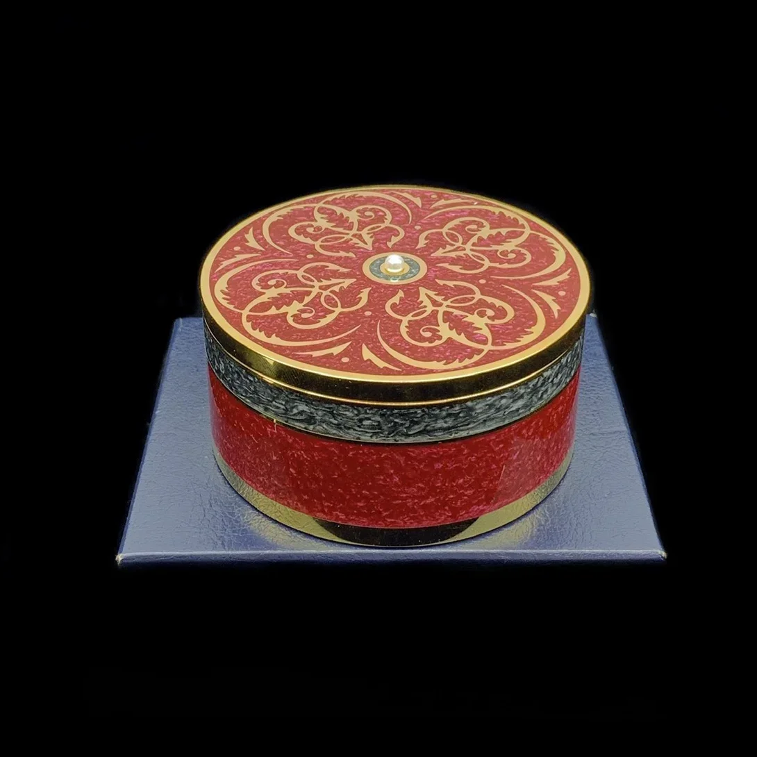 Marbled enamel colored pearl jewelry jar holds limited edition peripheral gifts from the wooden book