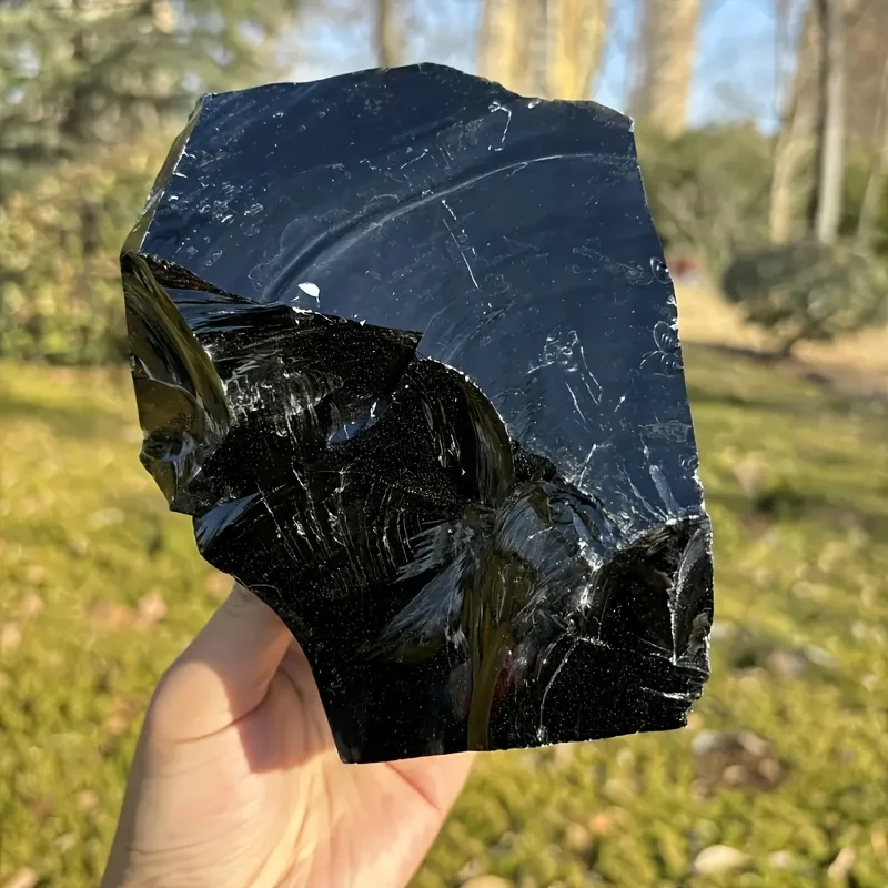 Large raw natural obsidian stones, natural black obsidian stones, natural obsidian for interior decoration.