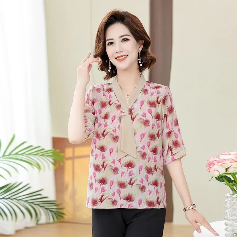 T-shirt a maniche lunghe con scollo a V alla moda con stelle filanti stampate allentate da donna in chiffon