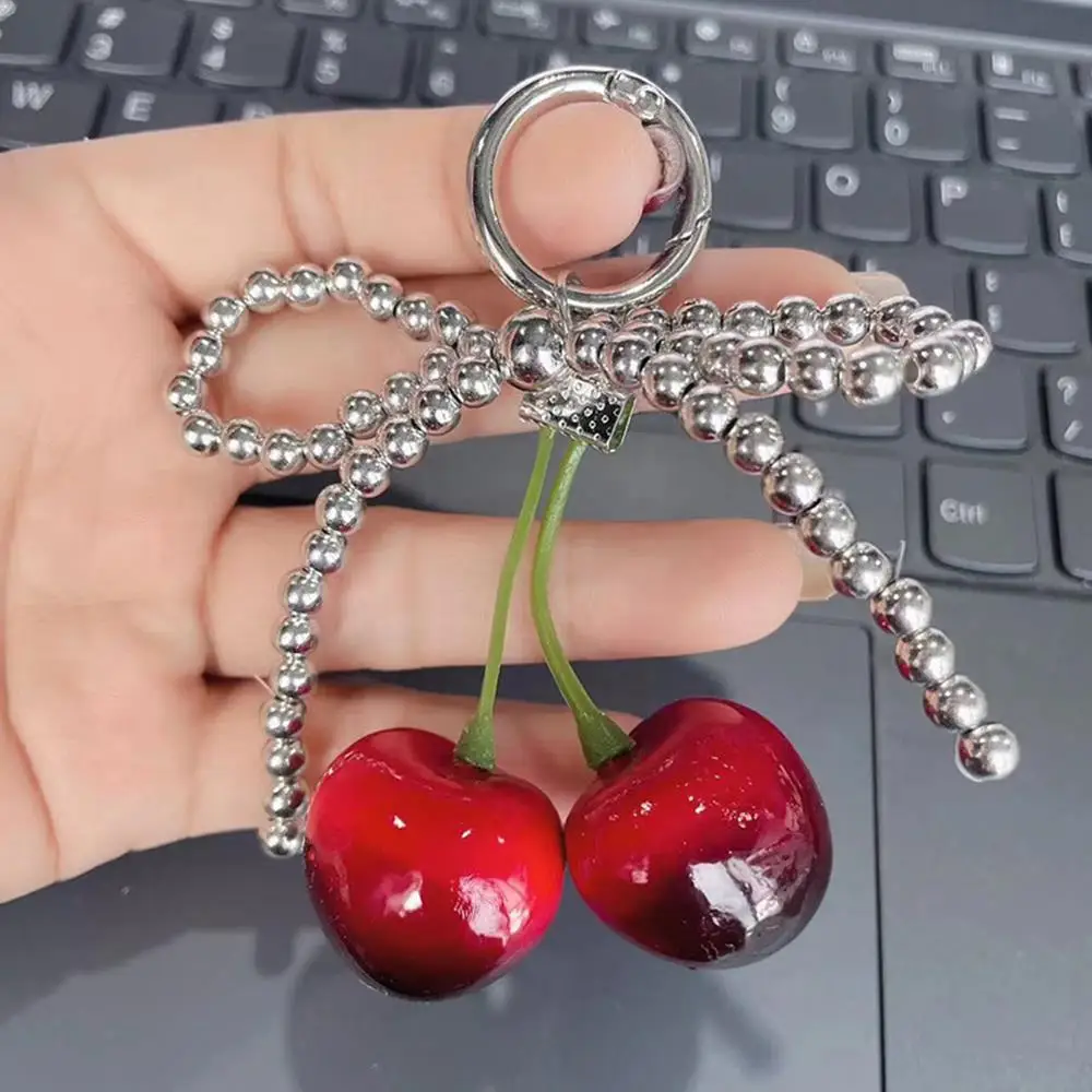 الكرز حقيبة سحر الهاتف ديكور ظهره الديكور حقيبة قلادة المفاتيح مقوس دانتيل الشريط تقليد اللؤلؤ Bowknot سلسلة مفاتيح