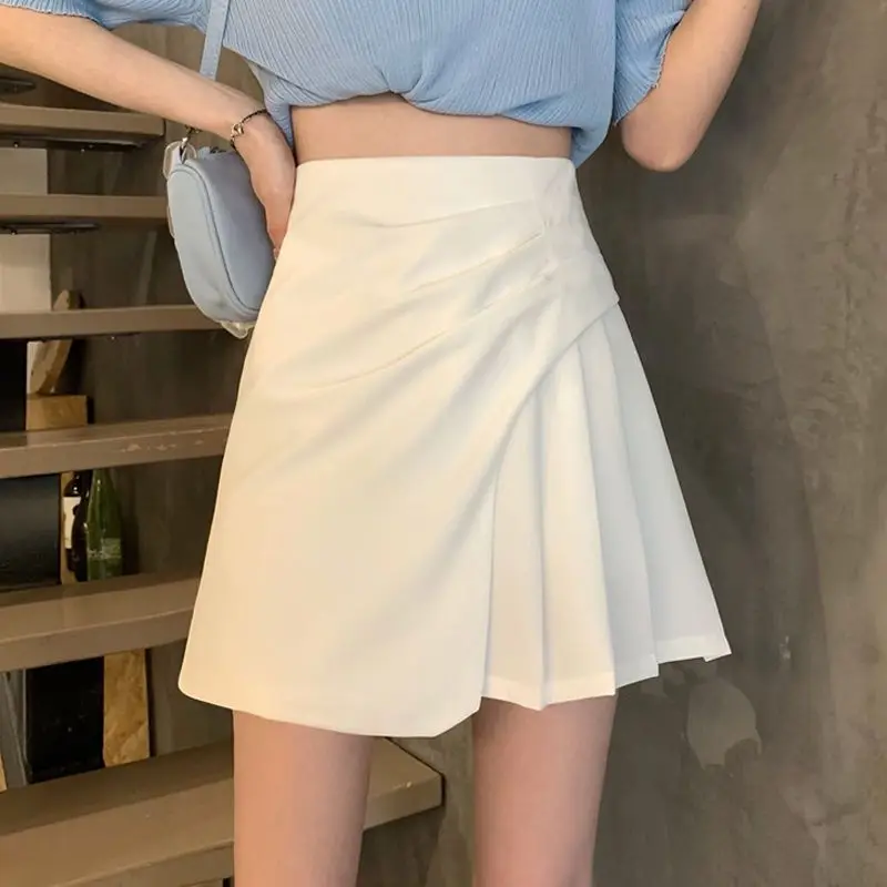 Fashion Zipper Solid Color Asymmetrical Pleated Short Skirts Women\'s Clothing 2024 Summer New Loose All-match Irregular Skirts