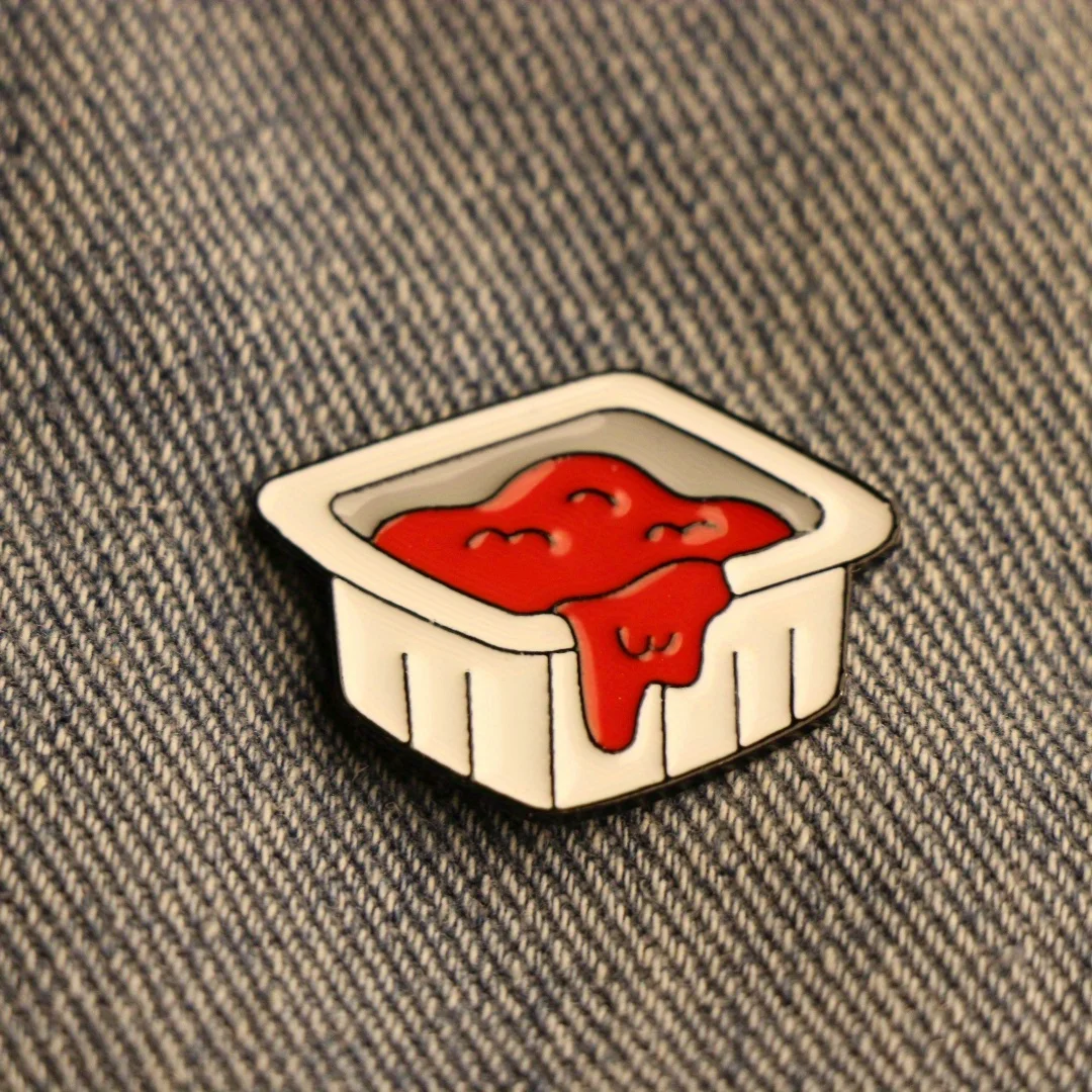 Quirky open ketchup bottle brooch for unisex backpack and clothing flair.