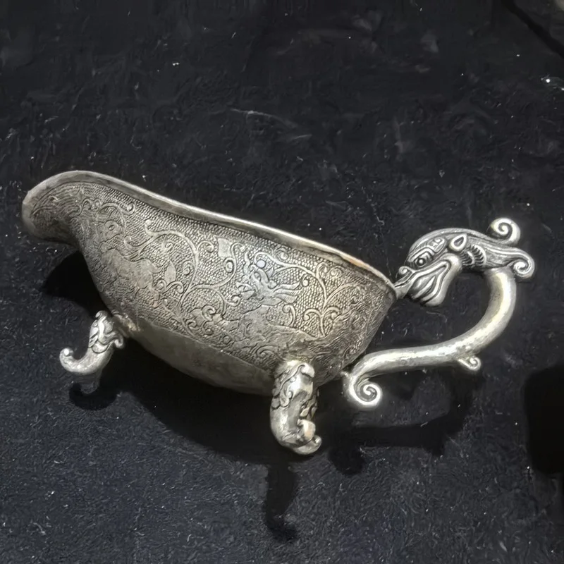 -plated Tang Dynasty-style three-legged , a retro decorative piece with relief carving, a silver wine cup for display i