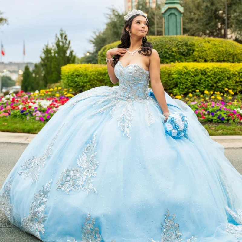

Light Blue Shiny Ball Gown Quinceanera Dresses 2026 Applique Beading Crystal Bow Tull Off Shoulder Sweet 16 Dress Years Vestidos