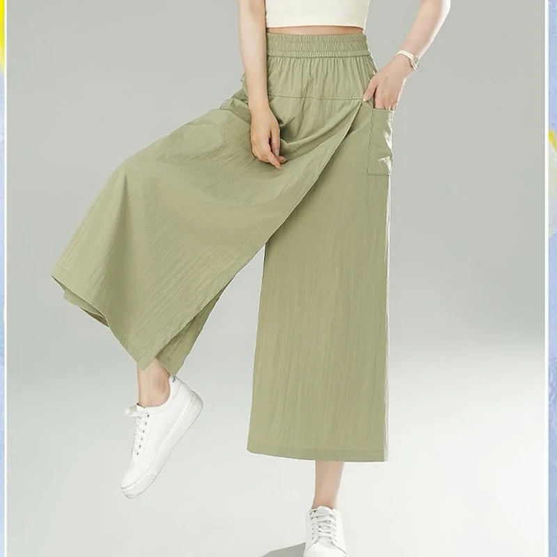 

Fashion Elastic Pockets Spliced Wide Leg Casual Pants Female Clothing 2024 Summer New Loose Solid Color High Waist Capri Pants