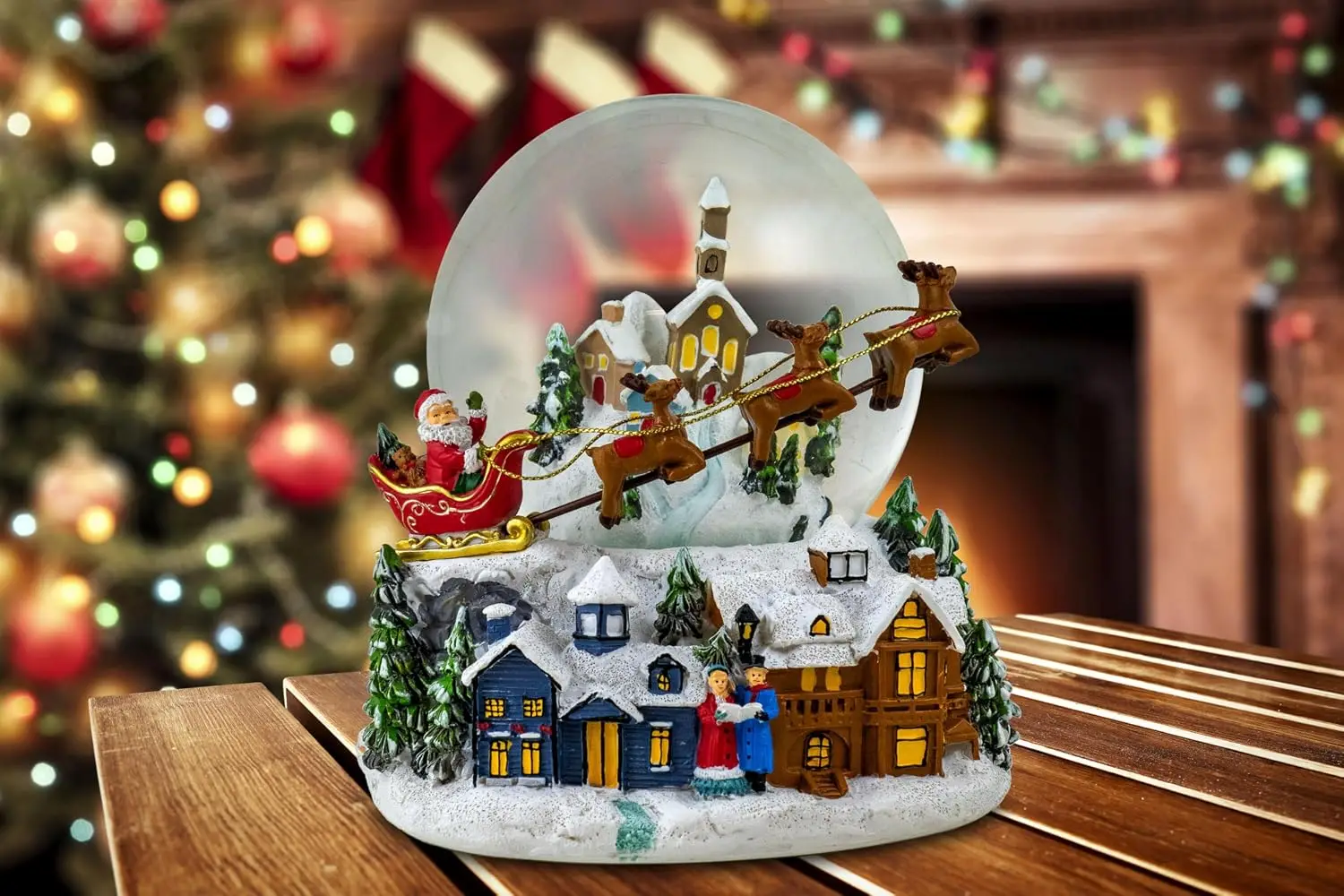 Snow Globe Featuring Santa and Reindeer Flying Over a Village
