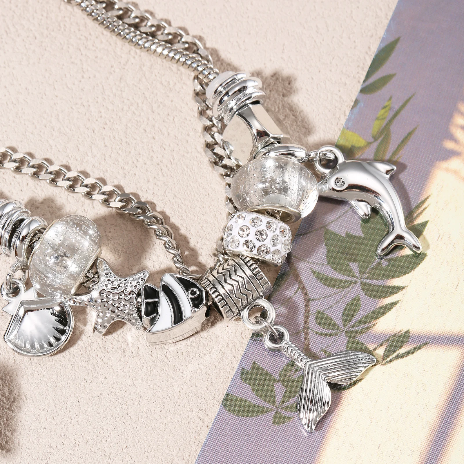 

Silvery Stainless Steel Ocean Charm Bracelet with Dolphin and Mermaid Tail Pendants for Women