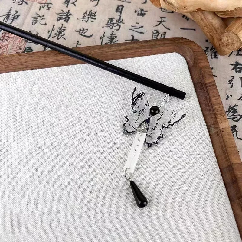 

A high-end ink-wash calligraphy butterfly-shaped flowing rosewood hair clip and an elegant high bun hair accessory